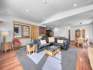 a living room with a couch and a table at 35A Union Creek Townhomes West townhouse in Copper Mountain