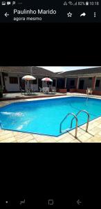 a picture of a swimming pool in a hotel at Pousada Por do Sol in Cananéia