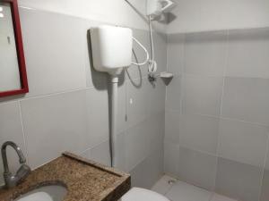 a bathroom with a toilet and a shower in it at Casa Prudente in Olinda