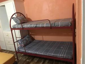 a couple of bunk beds in a room at Dangleben’s Apartment in Pointe Michel