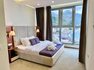 Postel nebo postele na pokoji v ubytování Hotel Porto Sole