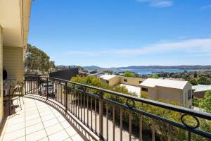 a balcony with a view of the city and water at Dromaius 5 - 3BR Townhouse l Lake Views l Spa Bath l WiFi l BBQ in Jindabyne