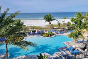 an aerial view of a resort pool and the beach at The Ritz-Carlton, Sarasota in Sarasota