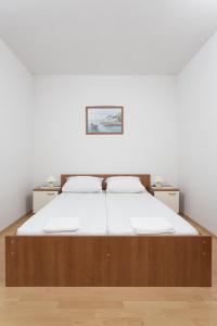 Ein Bett oder Betten in einem Zimmer der Unterkunft Vila Murvica