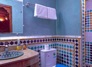 a bathroom with a sink and a counter top at Riad Dar Lalj Fes in Fez