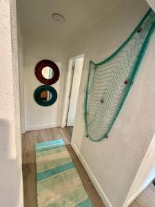 a living room with a net on the wall at Nice 2 Twin bedroom - Best central location in Miami - We have Drop off Service and Laundry for free!!!! in Miami