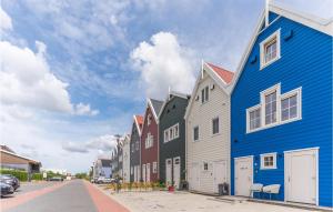 a row of colorful buildings on a street at Lovely Home In Harderwijk With Kitchen in Harderwijk