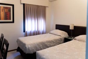 Voodi või voodid majutusasutuse Hotel Genoves toas