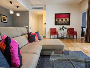 a living room with a couch and a table at St Mary Residences Jalan Tengah in Kuala Lumpur