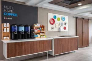 a coffee shop with a counter with bottles of coffee at Holiday Inn Express Hotel & Suites Chattanooga-Lookout Mountain, an IHG Hotel in Chattanooga