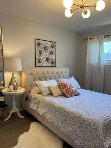 a bedroom with a bed with pillows on it at Lovely 2 bedrooms with parking in Carson in Carson
