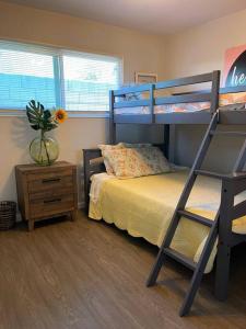 a bedroom with a bunk bed and a desk at Lovely 2 bedrooms with parking in Carson in Carson