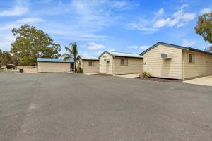 a row of garages in a parking lot at Costello Hotels - Moonta Bay Cabins in Port Moonta
