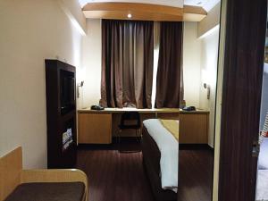 Krevet ili kreveti u jedinici u okviru objekta Tamarin Hotel Jakarta manage by Vib Hospitality Management