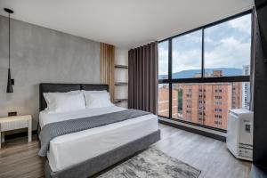 Postel nebo postele na pokoji v ubytování Apartamentos HOUSY Laureles