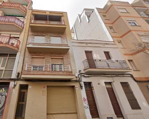 a tall building with balconies on the side of it at Sweet Room Barcelona in Hospitalet de Llobregat