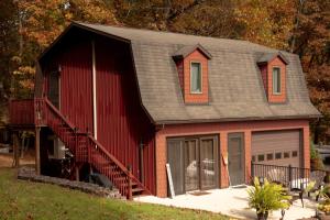 a red house with a gambrel roof at Historic Sears River Home (Main Level) on 10 Acres 