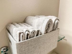 a basket filled with towels in a bathroom at 2BR Downtown Convention Center Near Attractions in Seattle