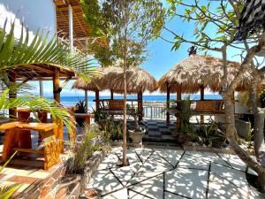 a resort with a view of the beach at Coastal Inn in Nusa Penida