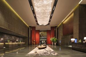 a lobby of a building with a large ceiling at InterContinental Changsha, an IHG Hotel in Changsha