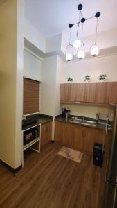 A cozinha ou cozinha compacta de A home, where you belong!(UNIT 119)