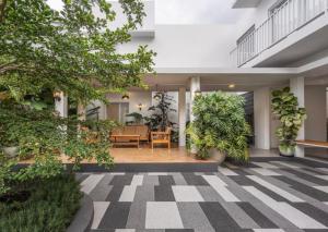 a courtyard with plants in a building at No303 in Bandung
