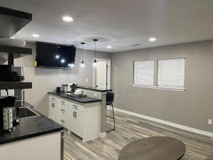 a kitchen with a counter top and a table at Apt 5 - High Plains Lodge at Nomad Landing in Clayton