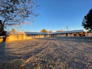 an empty parking lot in front of a building at Apt 5 - High Plains Lodge at Nomad Landing in Clayton +8 photos