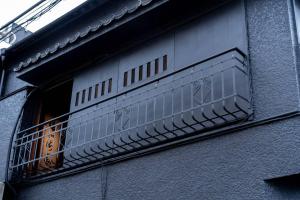 an open window of a building with a balcony at CraftFlat Asakusa House in Tokyo