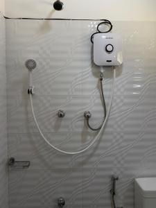 a shower with a blow dryer on the wall at Villa Lake Mountain in Weligama