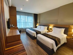 Postel nebo postele na pokoji v ubytování ZOOM HOTEL