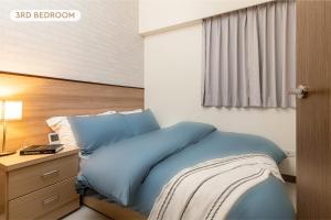 Letto o letti in una camera di High Floor New Bldg 4B2bLDK Ximending, Stunning Views • 高層新樓 4房2衛 西門町 美景