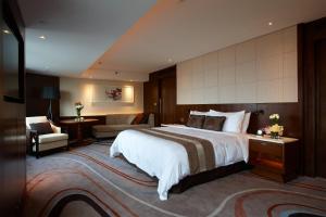 Ένα ή περισσότερα κρεβάτια σε δωμάτιο στο White Swan Hotel