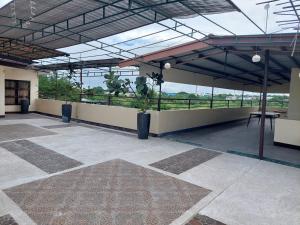 a large room with a view of a building at MaClare Resort in Imus