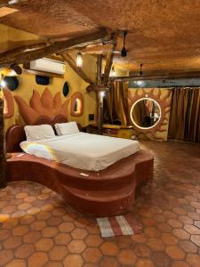 a bedroom with a large bed in a room at Udaya Resort in Palakkad +48 photos