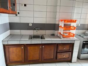 a kitchen with a sink and a counter top at Joel House deido in Douala