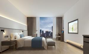 Postel nebo postele na pokoji v ubytování Jinxi Aerial Riverview Hotel - Chongqing Jiefangbei Hongya Cave
