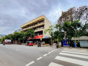 a building on the side of a street with a crosswalk at Kandy City Mission in Kandy +14 photos