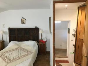 a bedroom with a bed and a door to a hallway at FLC - Large Charming House - Swimming Pool in Lambesc