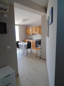A kitchen or kitchenette at Attico Del Sole