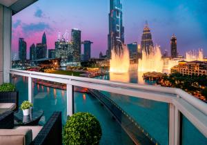 a view of a city skyline from a balcony with a fountain at Elite Royal Apartment - Full Burj Khalifa & Fountain View - Premier - 2 bedrooms & 1 open bedroom without partition in Dubai