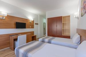 En eller flere senge i et værelse på Mirada Del Monte