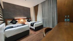 Voodi või voodid majutusasutuse MOMIZI HANOI 2 - PHAN KE BINH toas