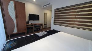 Voodi või voodid majutusasutuse MOMIZI HANOI 2 - PHAN KE BINH toas