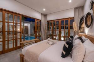 Letto o letti in una camera di CASA BIARI : Tropical Vibes - 3 min from beach