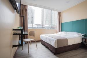 Postel nebo postele na pokoji v ubytování Hotel 28 Titiwangsa