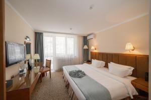 Postel nebo postele na pokoji v ubytování Jannat Resort