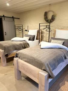 two beds sitting in a room with at Lark One in Schleibnitz