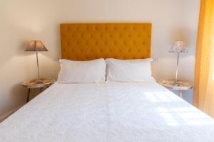 Voodi või voodid majutusasutuse Gian Paul Hotel toas