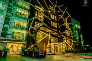 a building with a sculpture on the side of it at Best Hotel in Lagos - The Delborough in Lagos